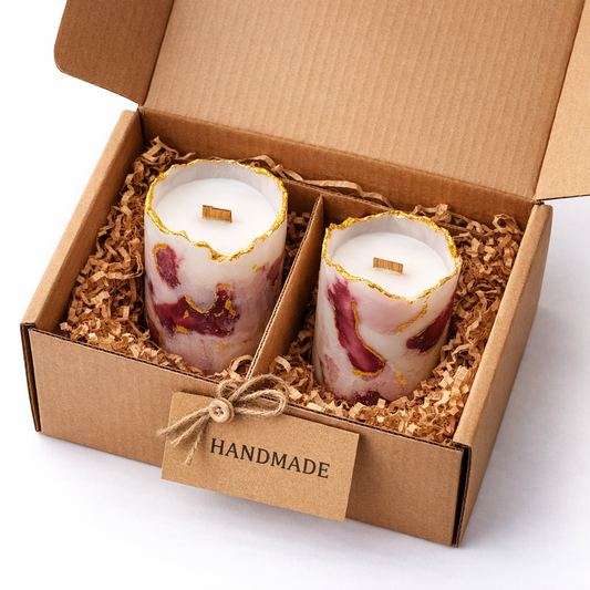 Handmade candles nestled in a kraft gift box — curating a luxury hamper